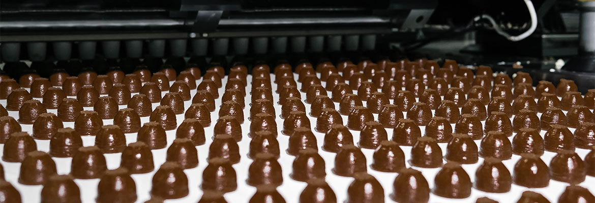 Chocolate toppings on the conveyor